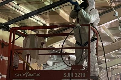 lead abatement services with worker removing lead from pipes